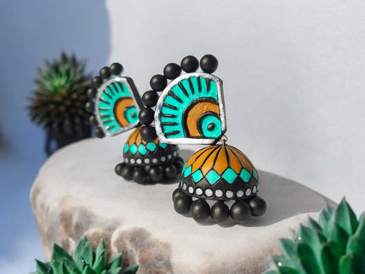Aachal ethnic terracotta jhumka earrings in turquoise and orange with black bead detailing from Anusangi Collections