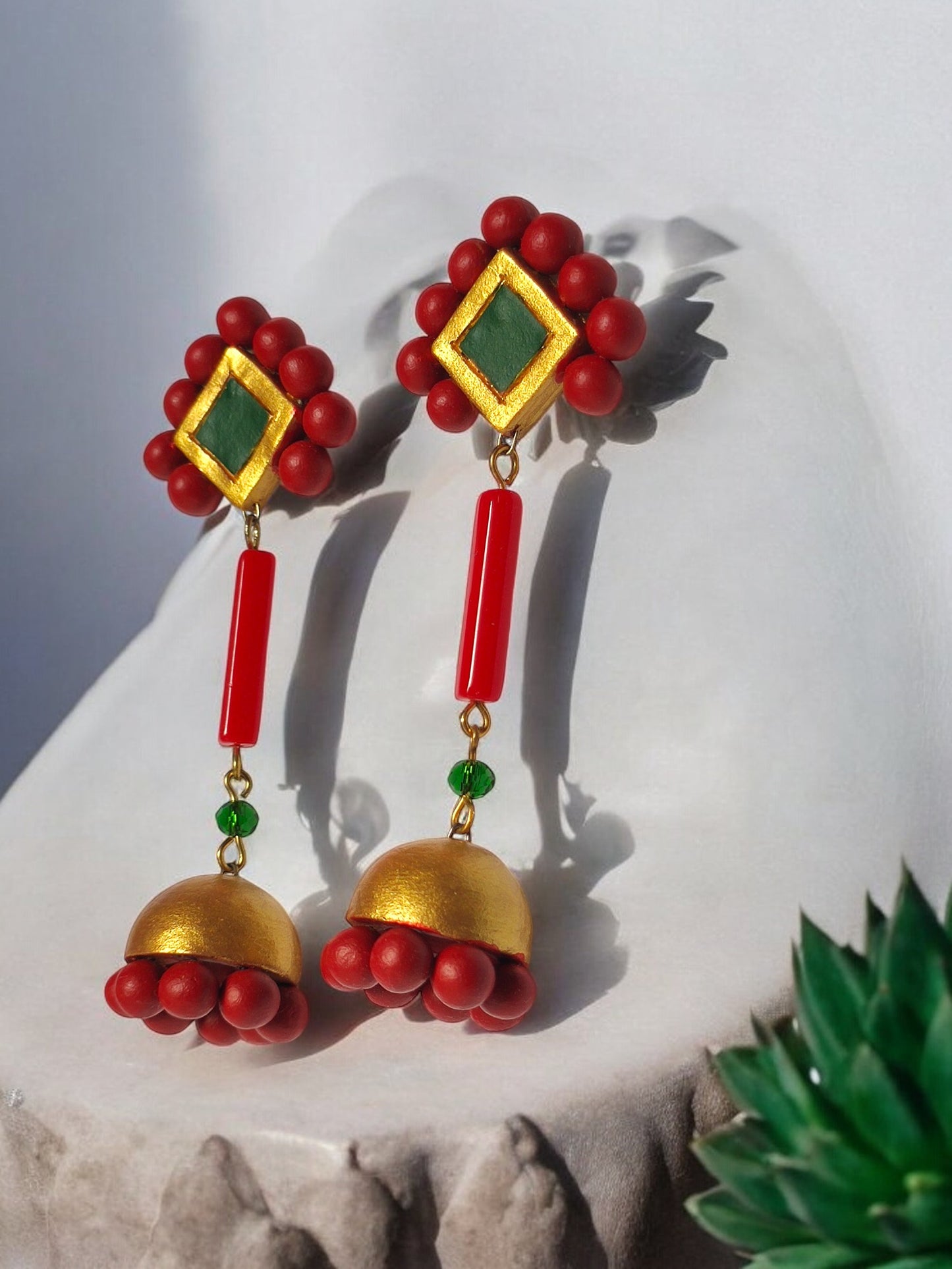 Anusangi Collections Abha statement dangle earrings in red and gold with green accents terracotta jewelry