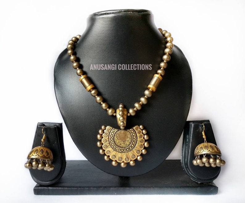 Handmade terracotta jewelry set with necklace and matching earrings in antique gold finish