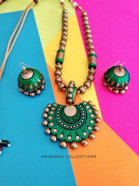 Handmade terracotta jewelry set with green and gold necklace and matching earrings by Anusangi Collections