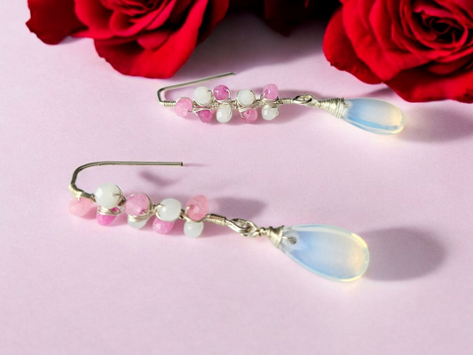 Pink and white beaded earring from Anusangi Collections with teardrop pendants and silver hooks