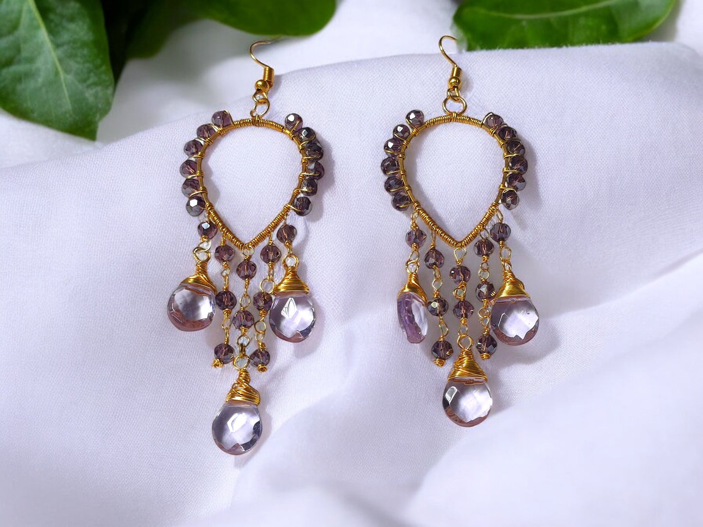 Anusangi Collections violet crystal earrings with gold-tone beaded teardrop design and dangling crystals