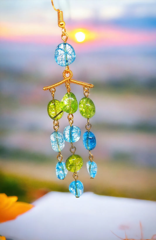 Anusangi Collections colorful beaded statement earrings with blue and green beads dangling on gold hooks