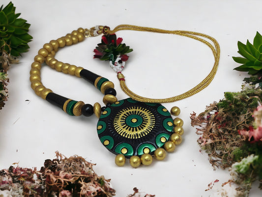 Black and gold terracotta necklace with round pendant and bead details from Anusangi Collections