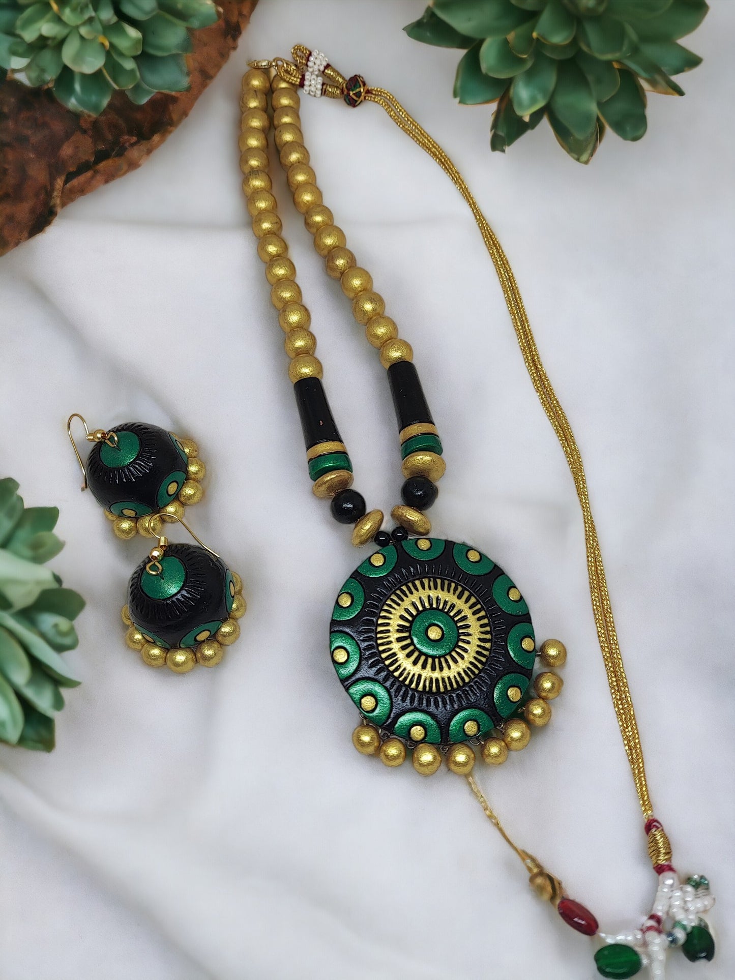 Black and gold terracotta necklace with matching earrings from Anusangi Collections in green and gold design