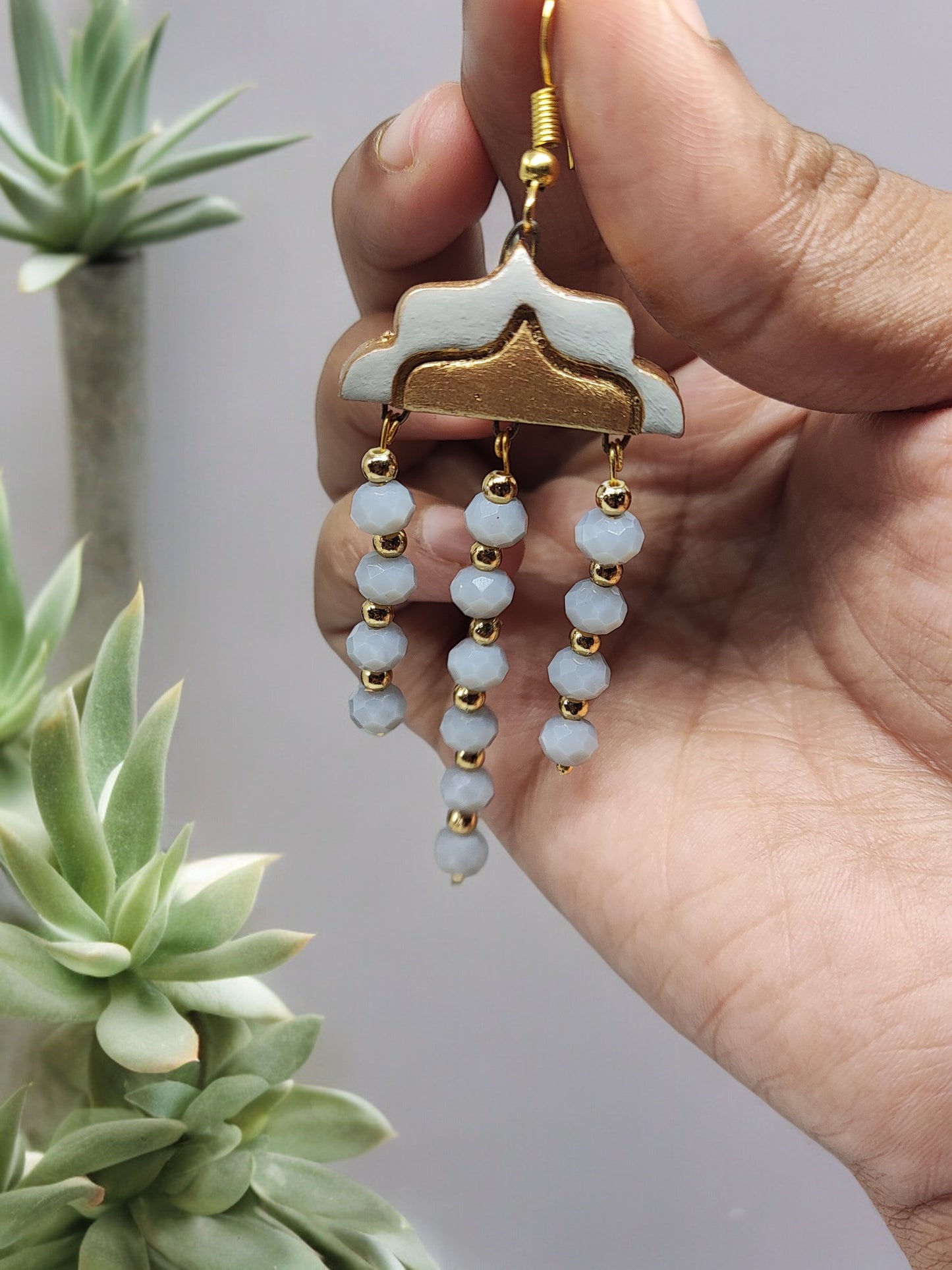 Boho chic gray terracotta earrings from Anusangi Collections with gold accents and bead dangles