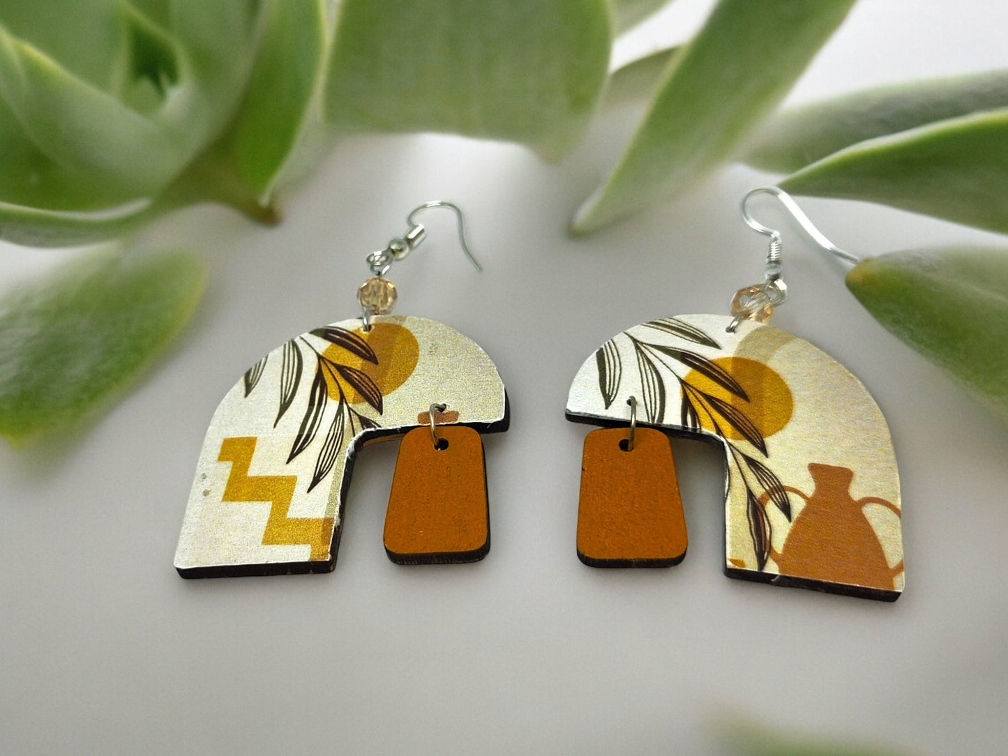 Anusangi Collections beaded boho dangle earrings for women with geometric and vase design