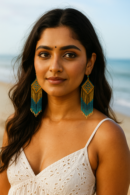 Woman wearing boho statement beaded earrings with blue and gold beads from Anusangi Collections