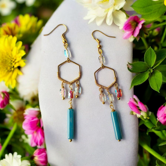 Anusangi Collections boho statement earrings for women featuring gold hexagon shapes with blue and clear beads
