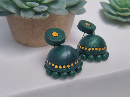 Bottle green terracotta jhumka earrings with golden dot accents from Anusangi Collections