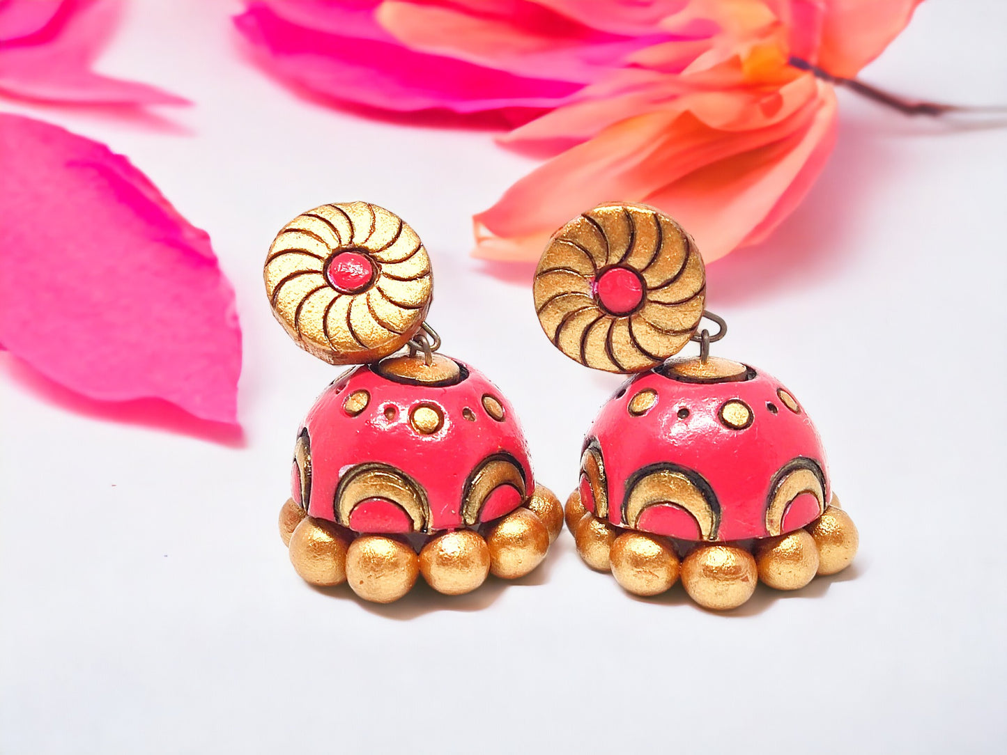 Terracotta earrings from Anusangi Collections with pink and gold detailing buy pink jhumka earrings online