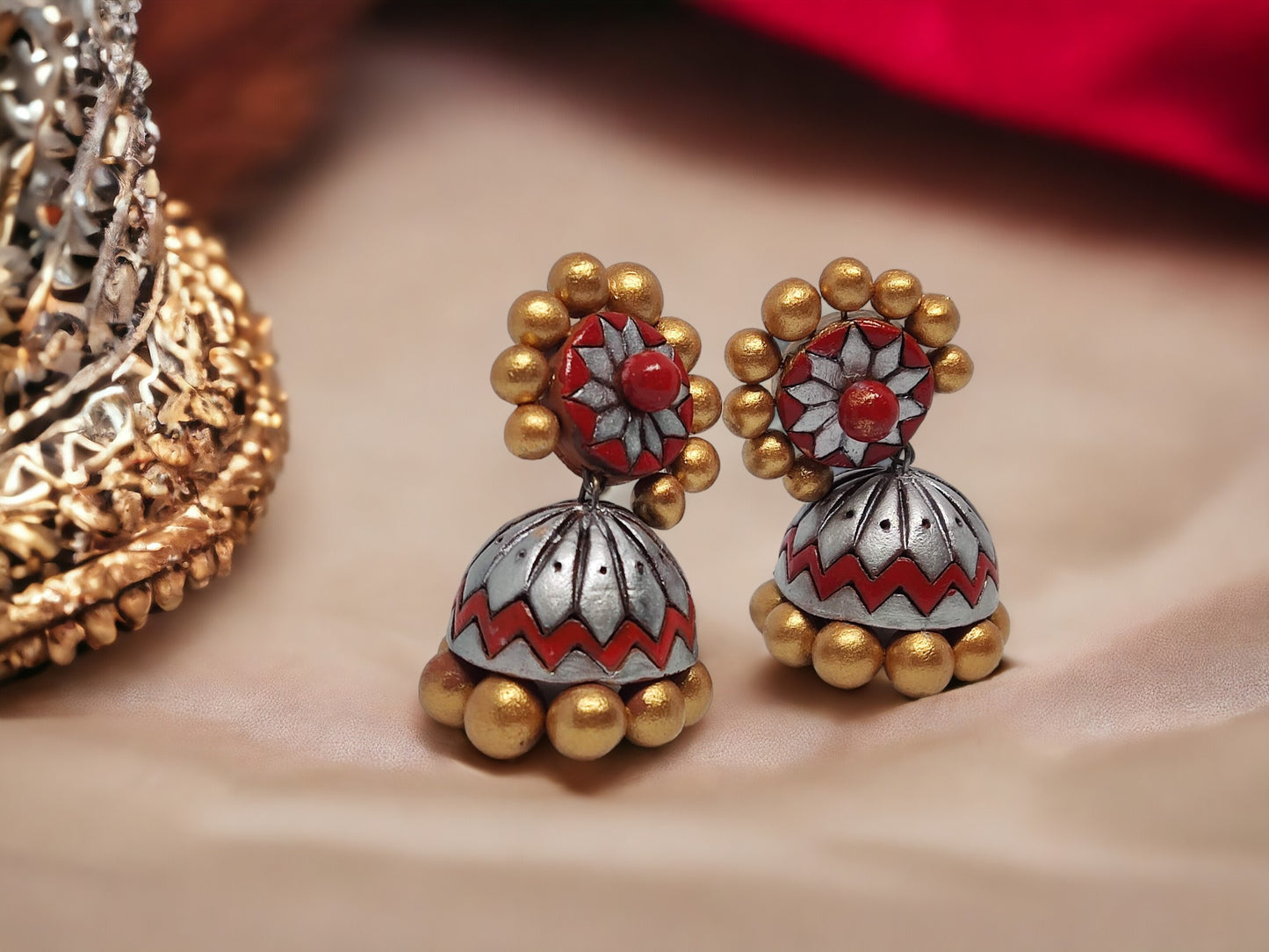 Buy traditional Jhumka terracotta earrings from Anusangi Collections with intricate red and gold detailing