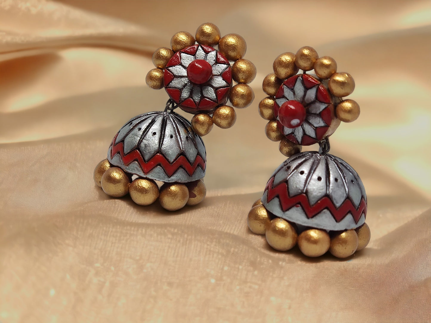 Buy traditional Jhumka terracotta earrings by Anusangi Collections with red and gold floral design