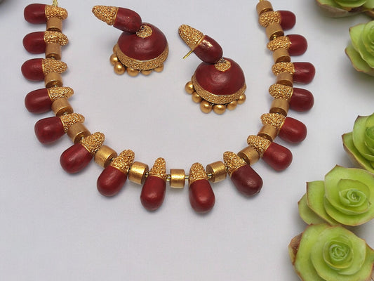 Classic terracotta necklace and earring set with maroon and gold beads by Anusangi Collections