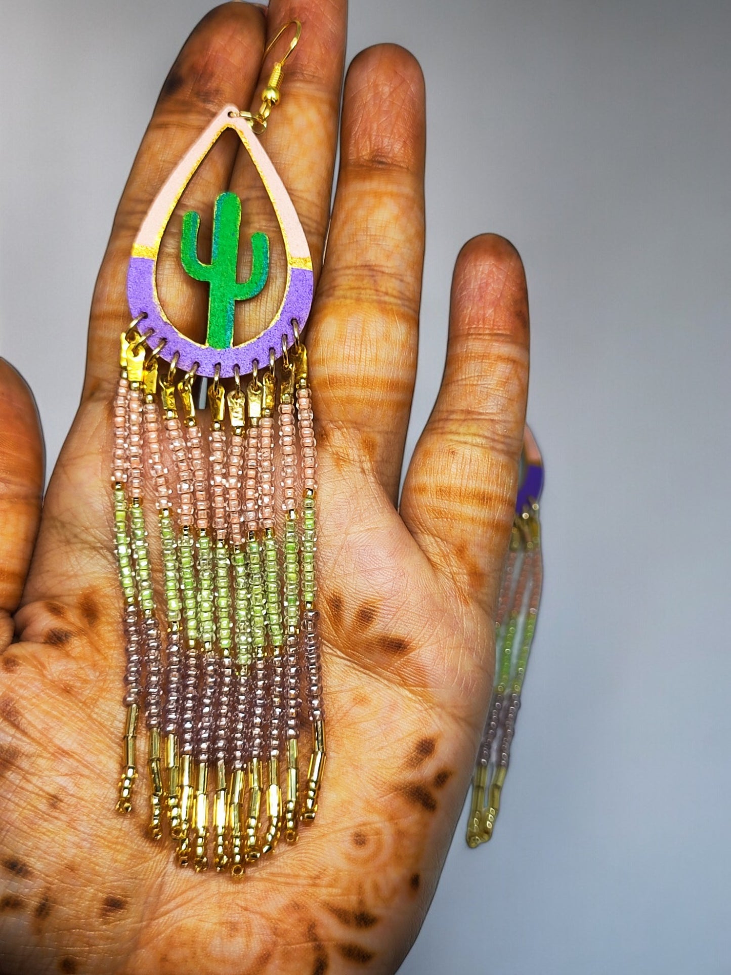 Colorful statement earrings for women with beaded fringes and green cactus design from Anusangi Collections