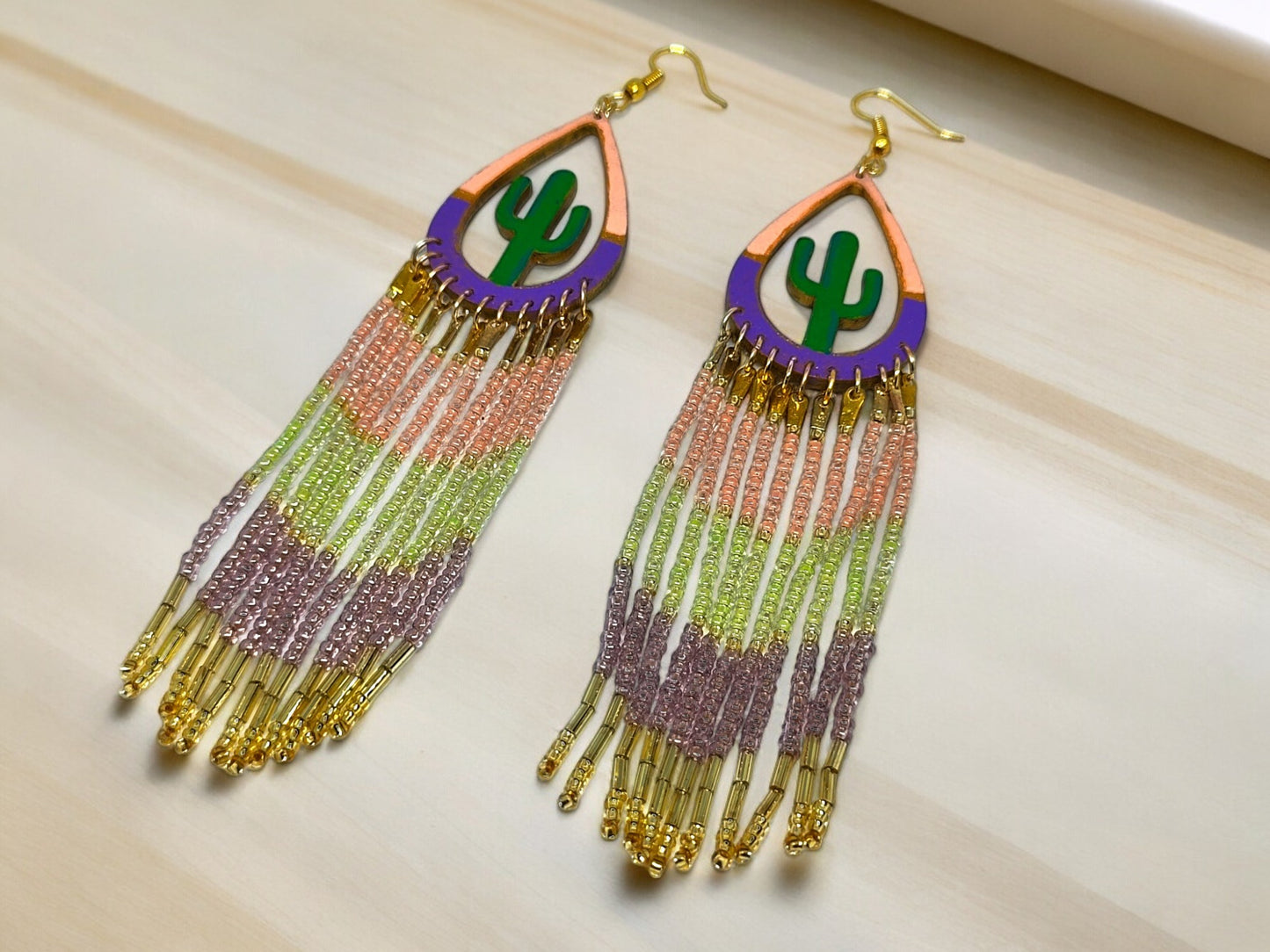 Colorful statement earrings for women with beaded tassels and cactus design by Anusangi Collections