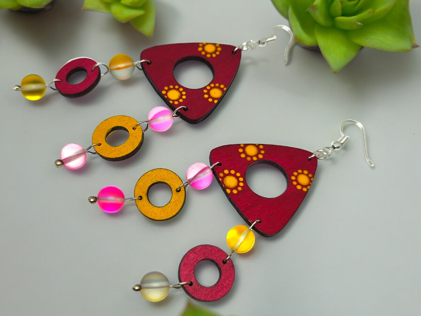 Colorful terracotta earrings for women with red and yellow geometric patterns and beaded accents