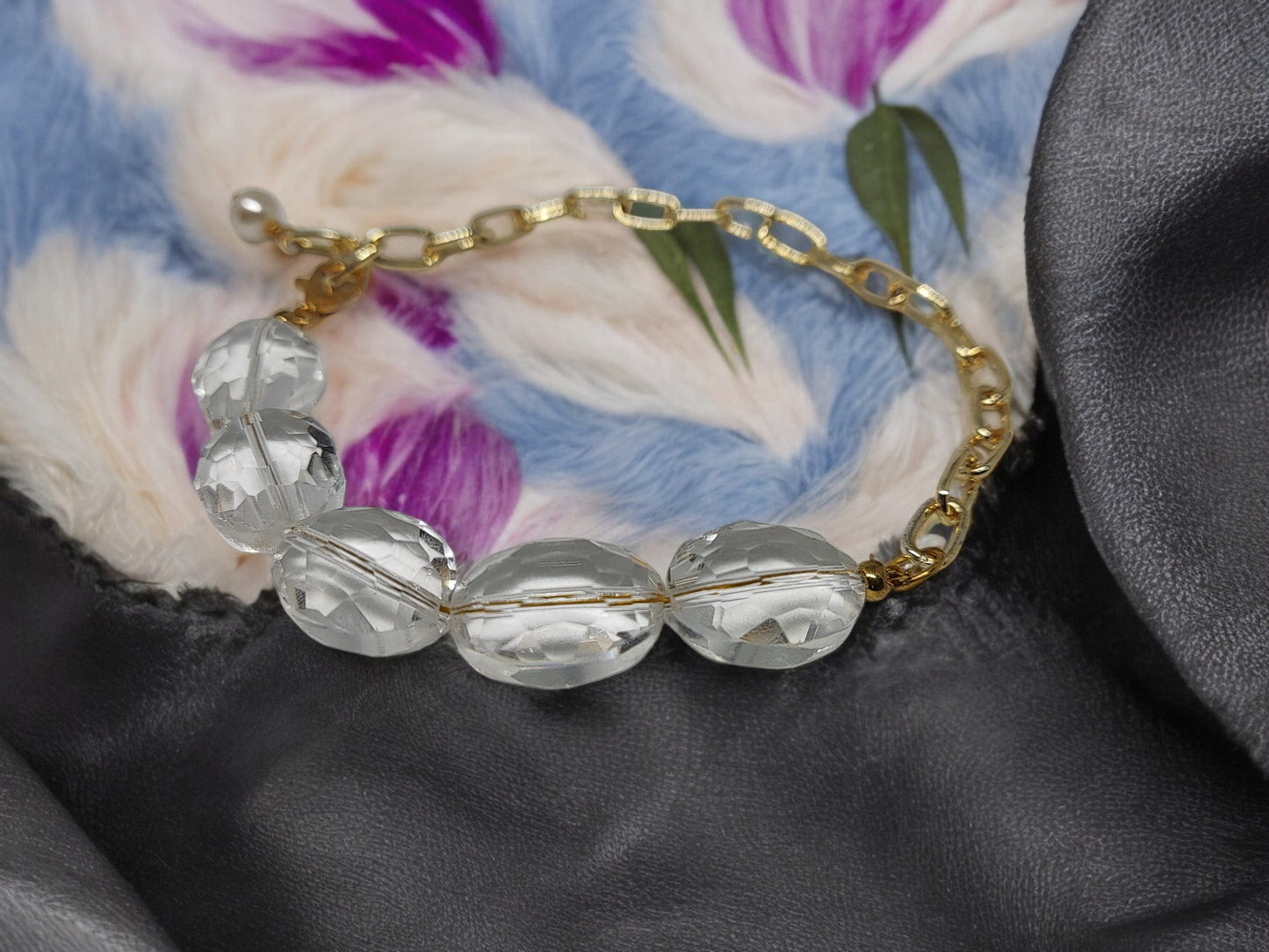 Anusangi Collections delicate crystal bracelet handmade with clear beads and gold chain on soft fabric