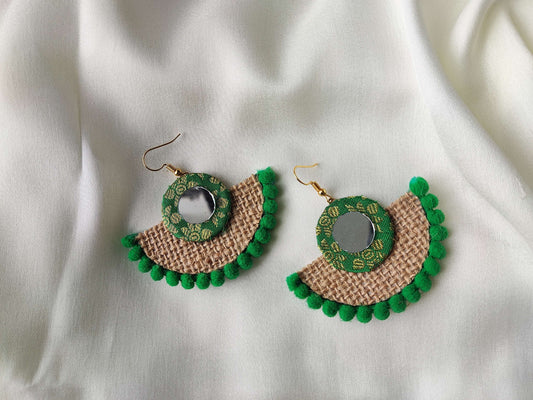 Anusangi Collections fabric earrings with mirror design featuring green accents and textured beige fabric