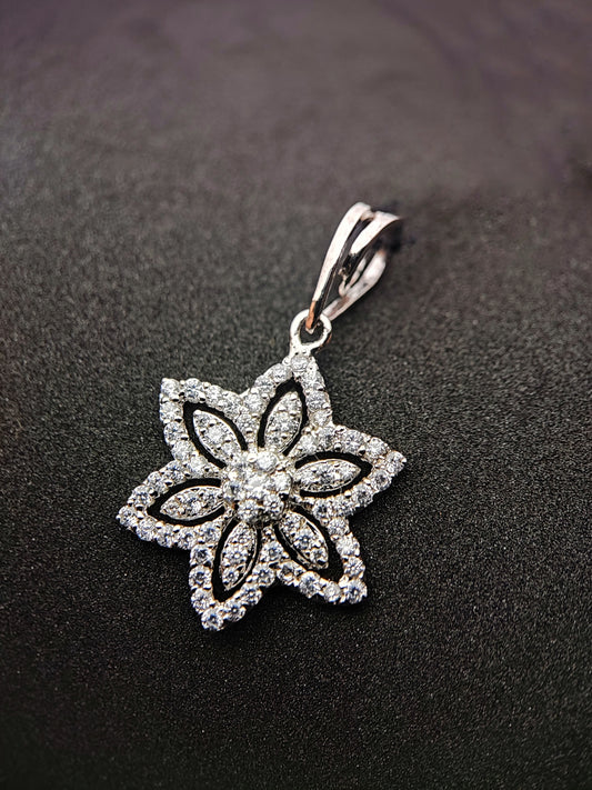 Floral sterling silver necklace pendant with intricate flower design and sparkling stones