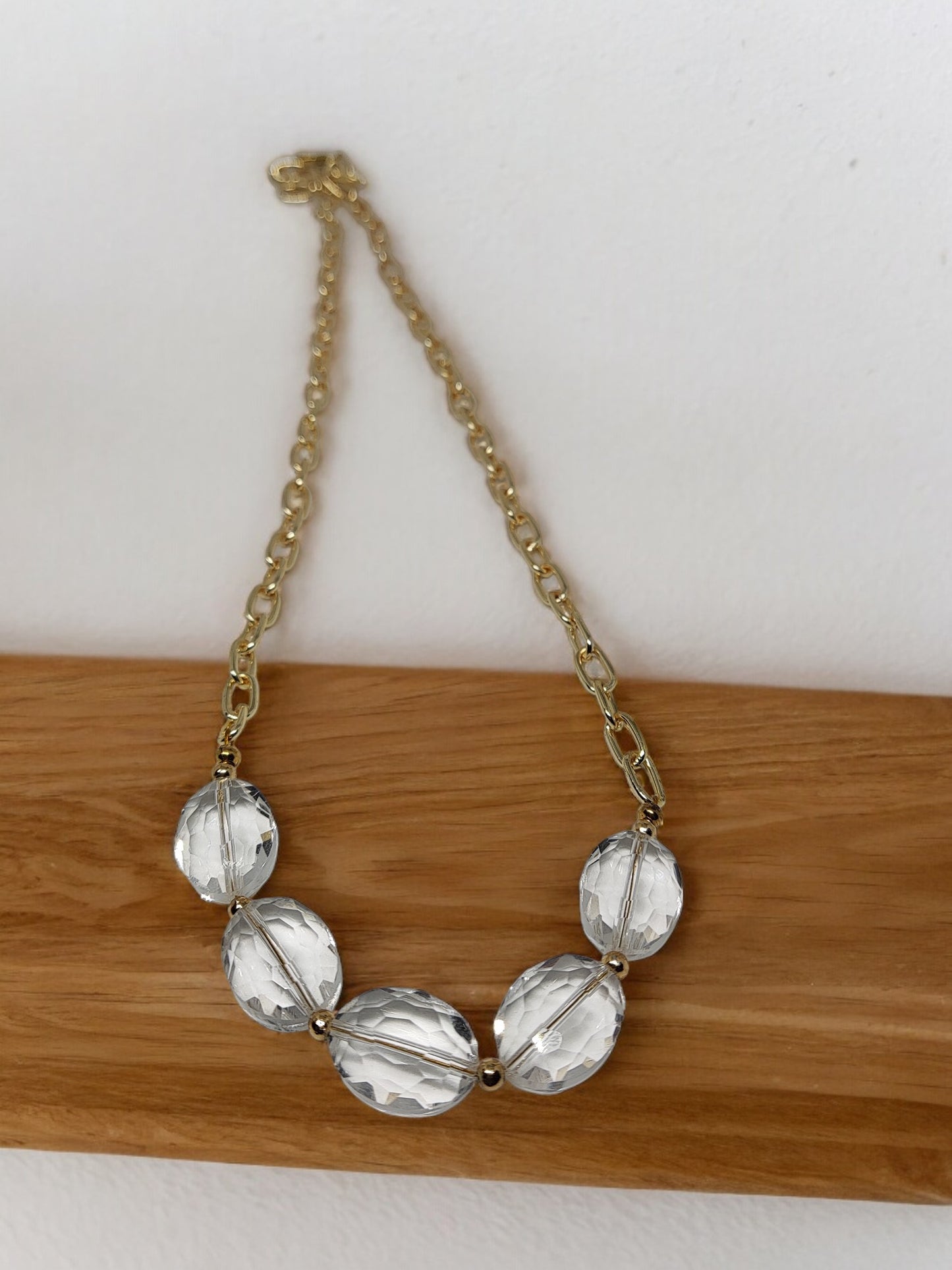 Anusangi Collections crystal clear necklace earring set with large clear beads and gold chain