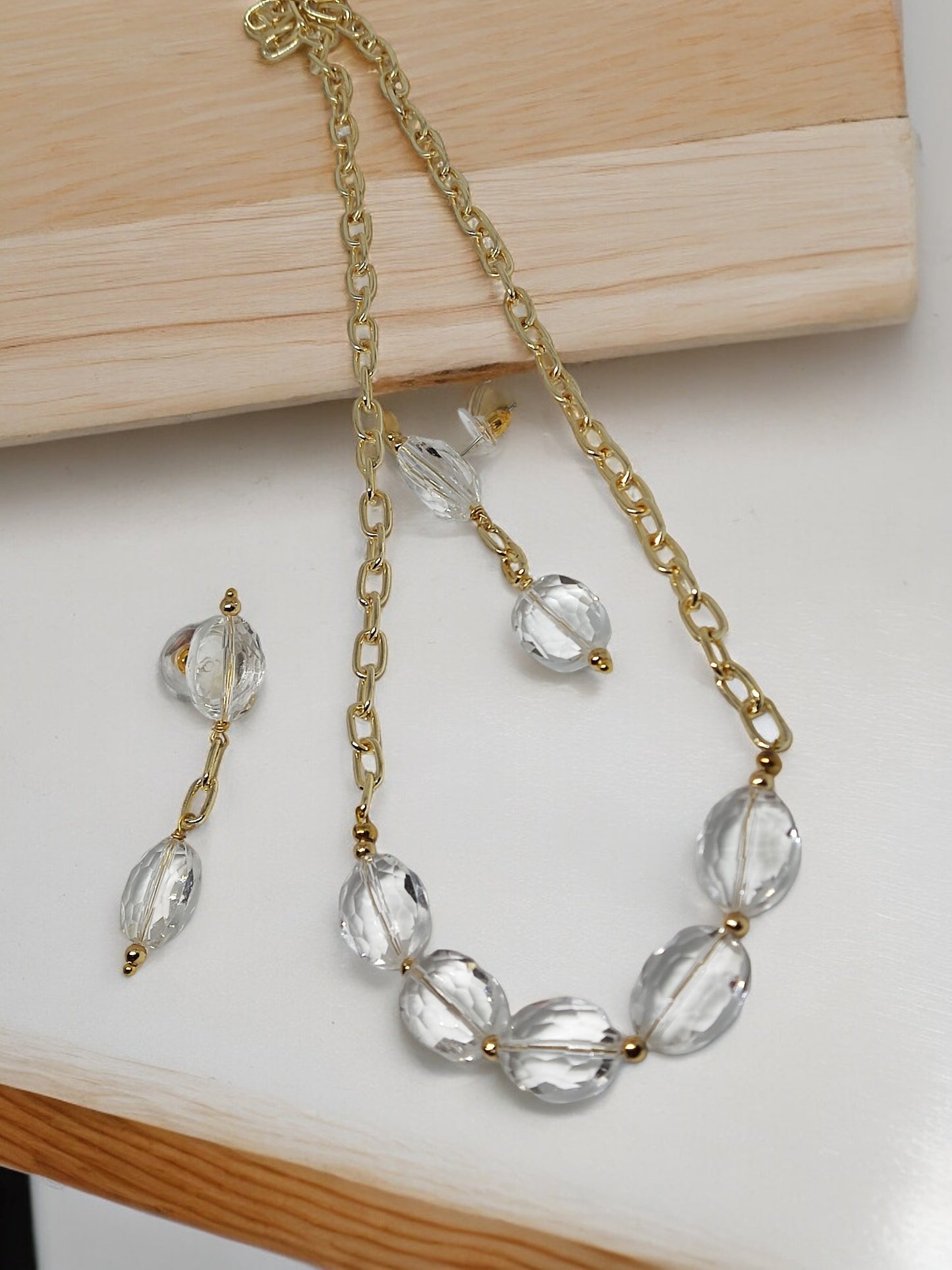 Crystal clear necklace earring set with gold chain and large transparent beads from Anusangi Collections