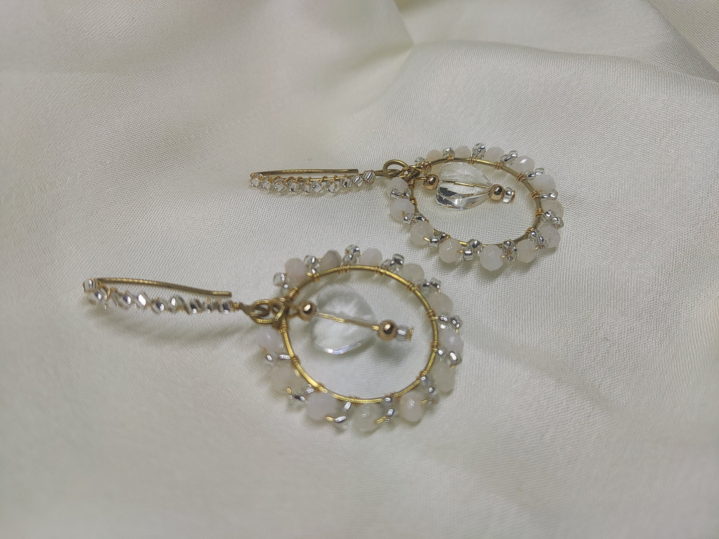 Anusangi Collections beaded white wire wrap earrings with gold-tone hoops and clear beads