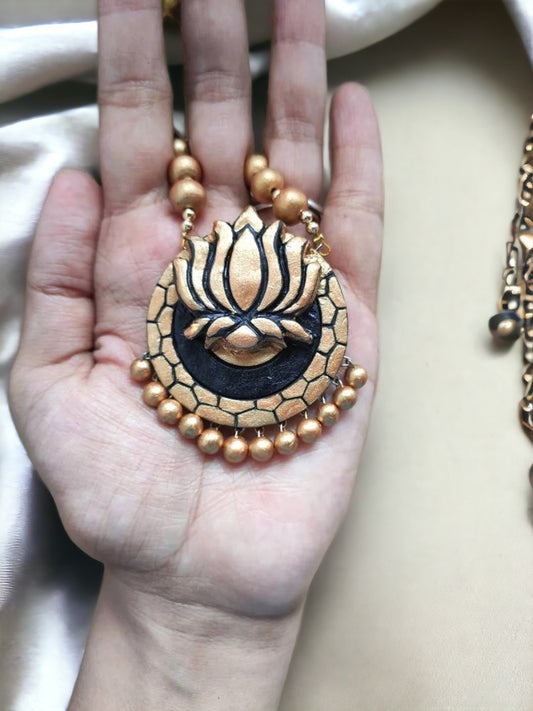 Golden lotus necklace for women terracotta jewelry set pendant held in hand with bead chain by Anusangi Collections