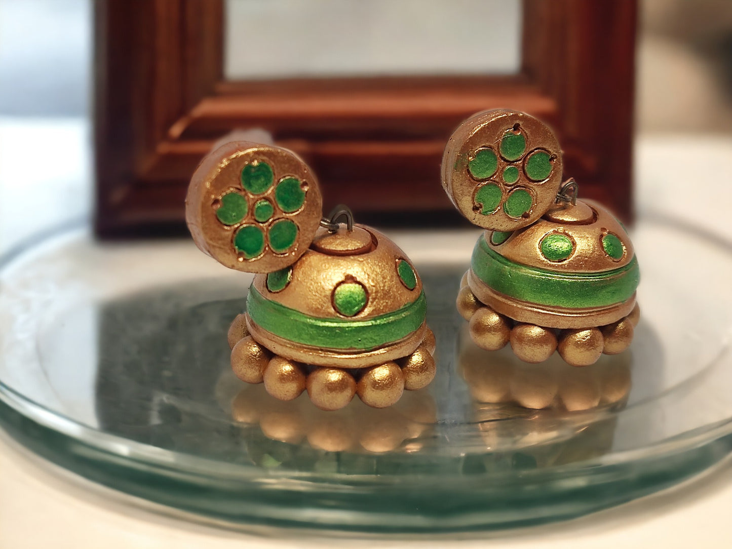 Green and gold jhumka online terracotta earrings by Anusangi Collections with traditional design