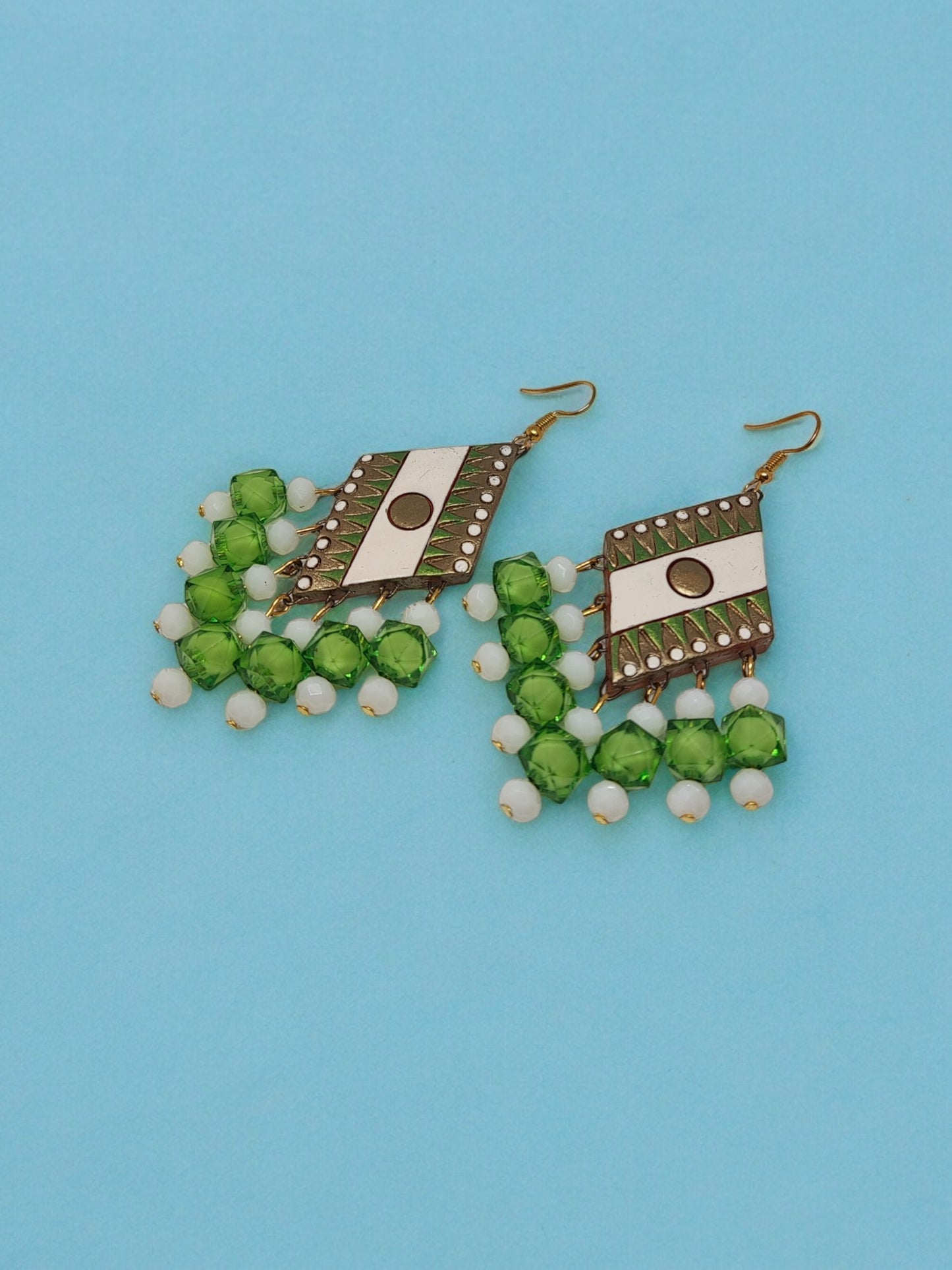 Green geometric design terracotta earrings with white beads from Anusangi Collections