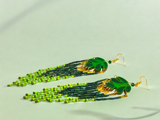 Anusangi Collections green leaf beaded earrings with long fringe and gold hook accents