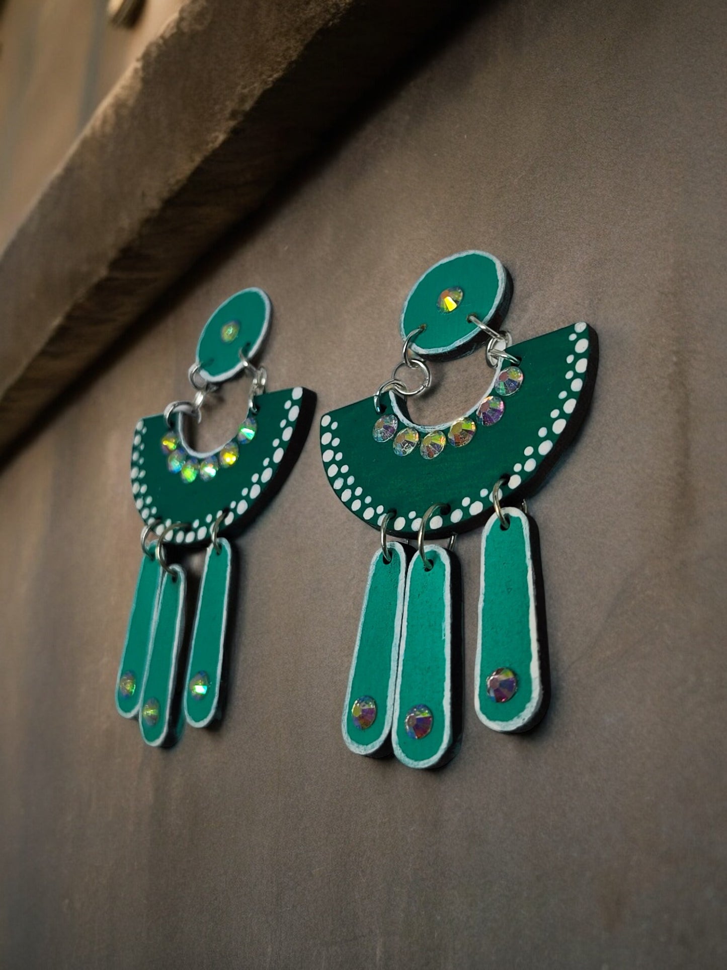 Anusangi Collections green terracotta earrings with beaded detailing and decorative hanging elements