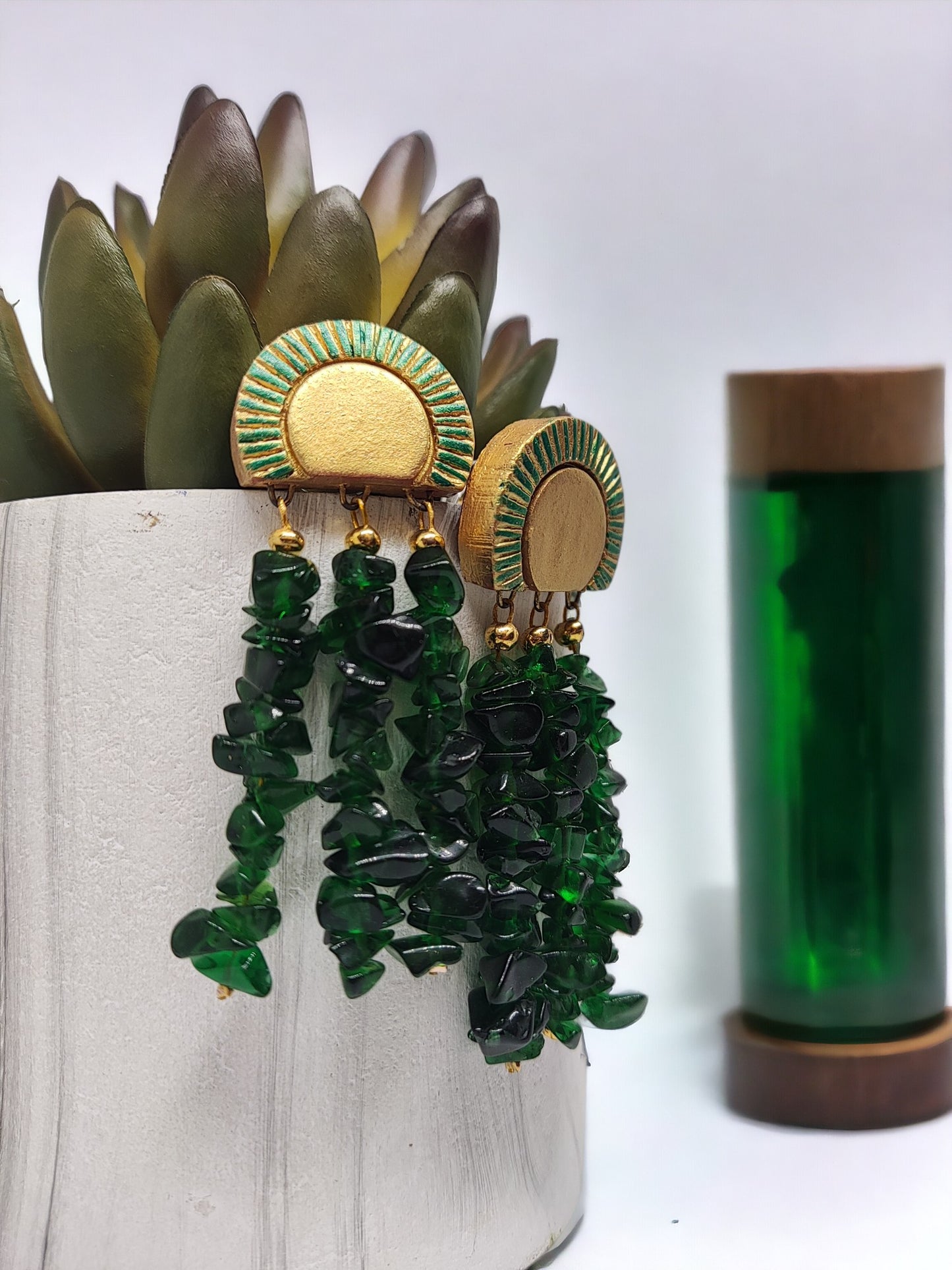 Green terracotta earrings from Anusangi Collections with gold and green detailing and dangling stone beads