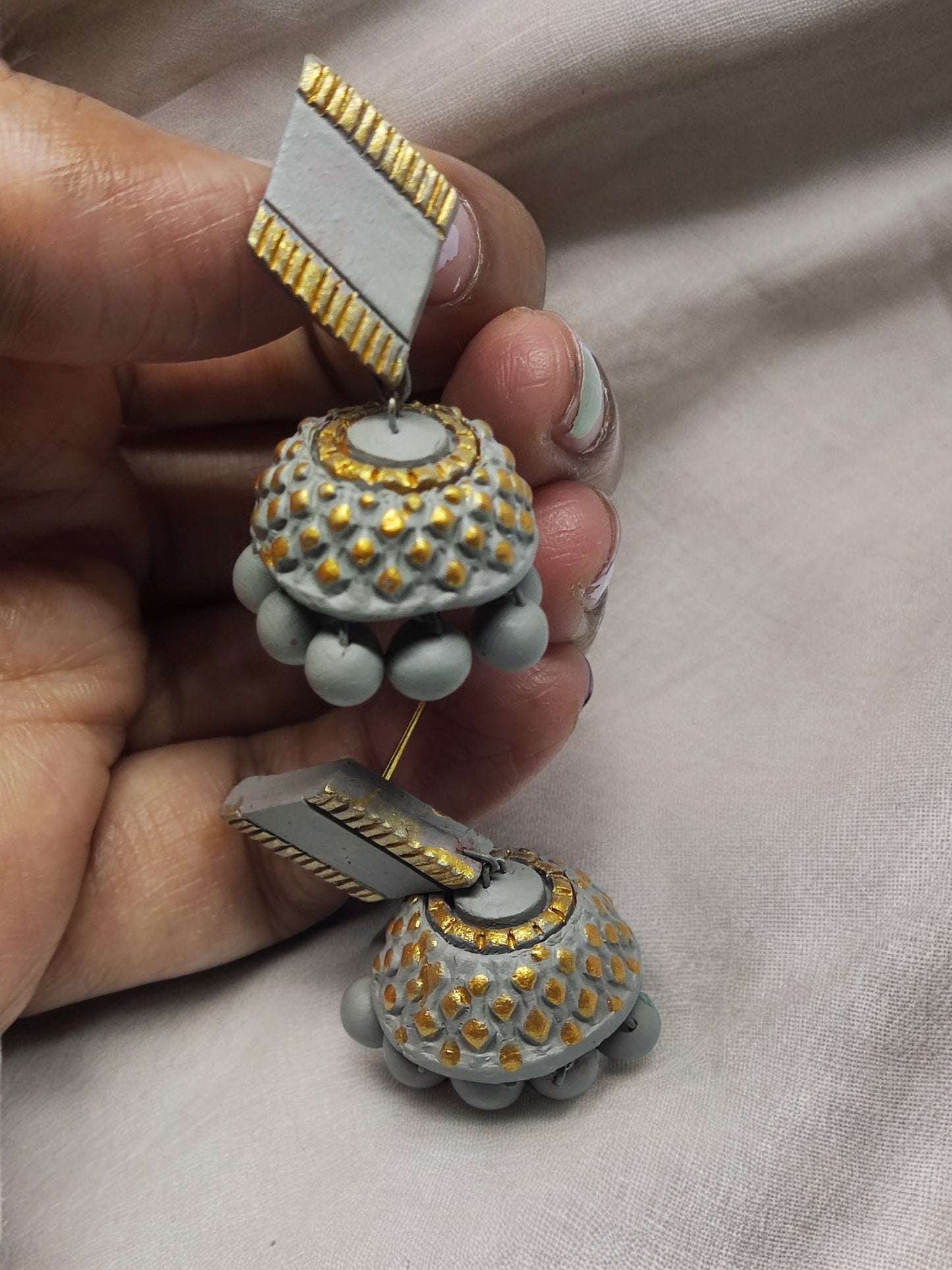 Handcrafted grey terracotta earrings with golden dotted design and bead detailing from Anusangi Collections