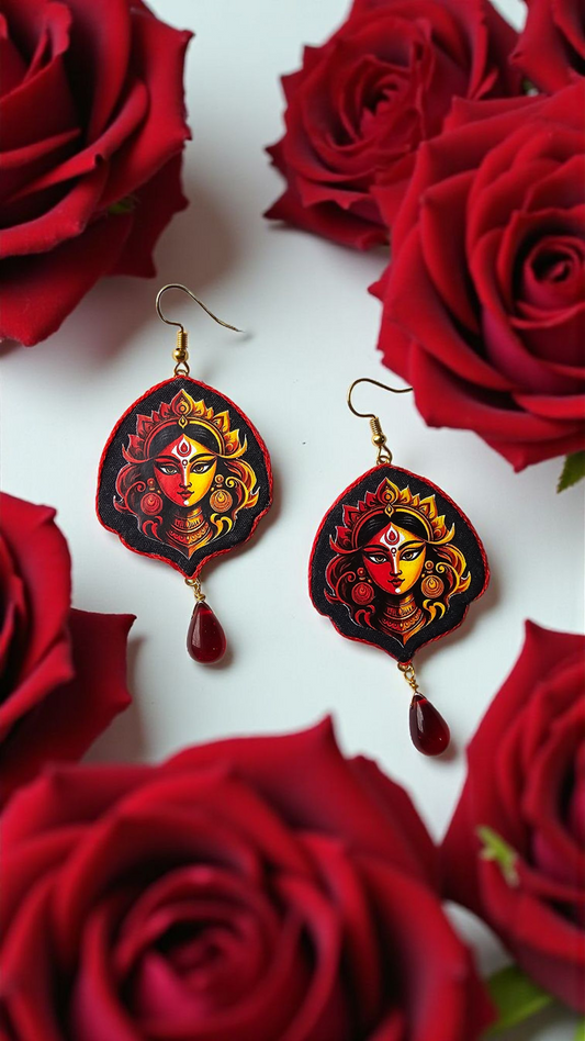 Hand-painted Durga face earrings with vibrant colors and elegant drop design surrounded by red roses