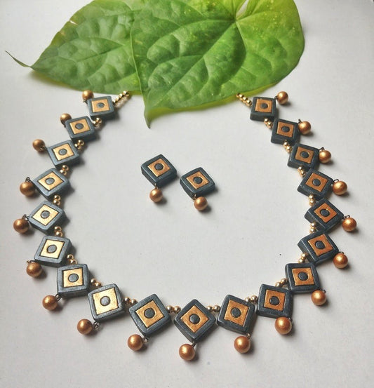 Anusangi Collections terracotta necklace set online with square black and gold design and matching earrings