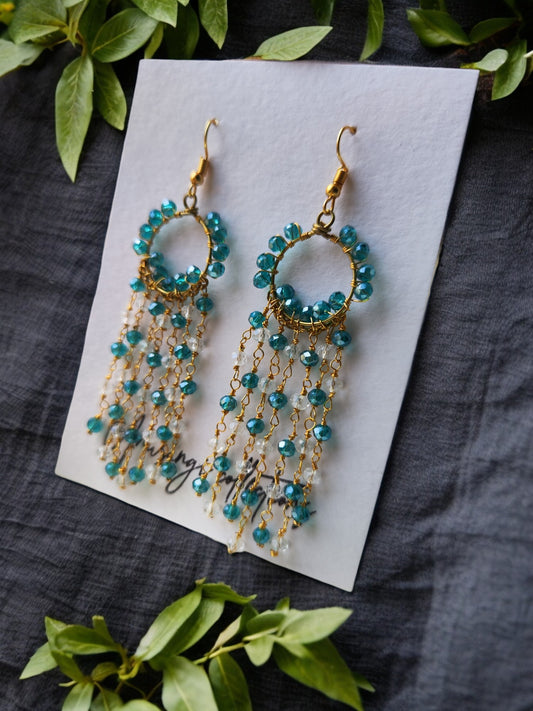 Anusangi Collections handmade beaded earrings with blue beads and gold chain tassels