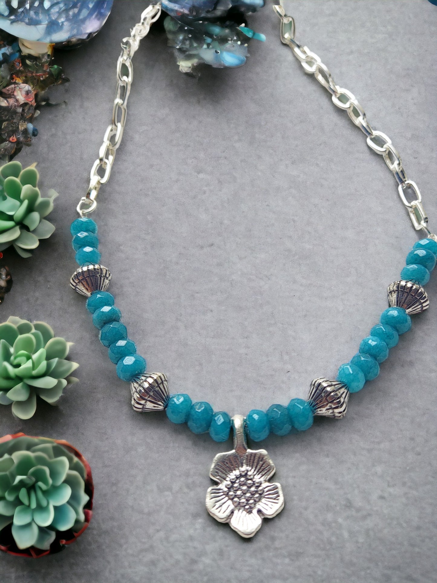 Handmade flower motif jewelry necklace with blue beads and silver flower pendant by Anusangi Collections