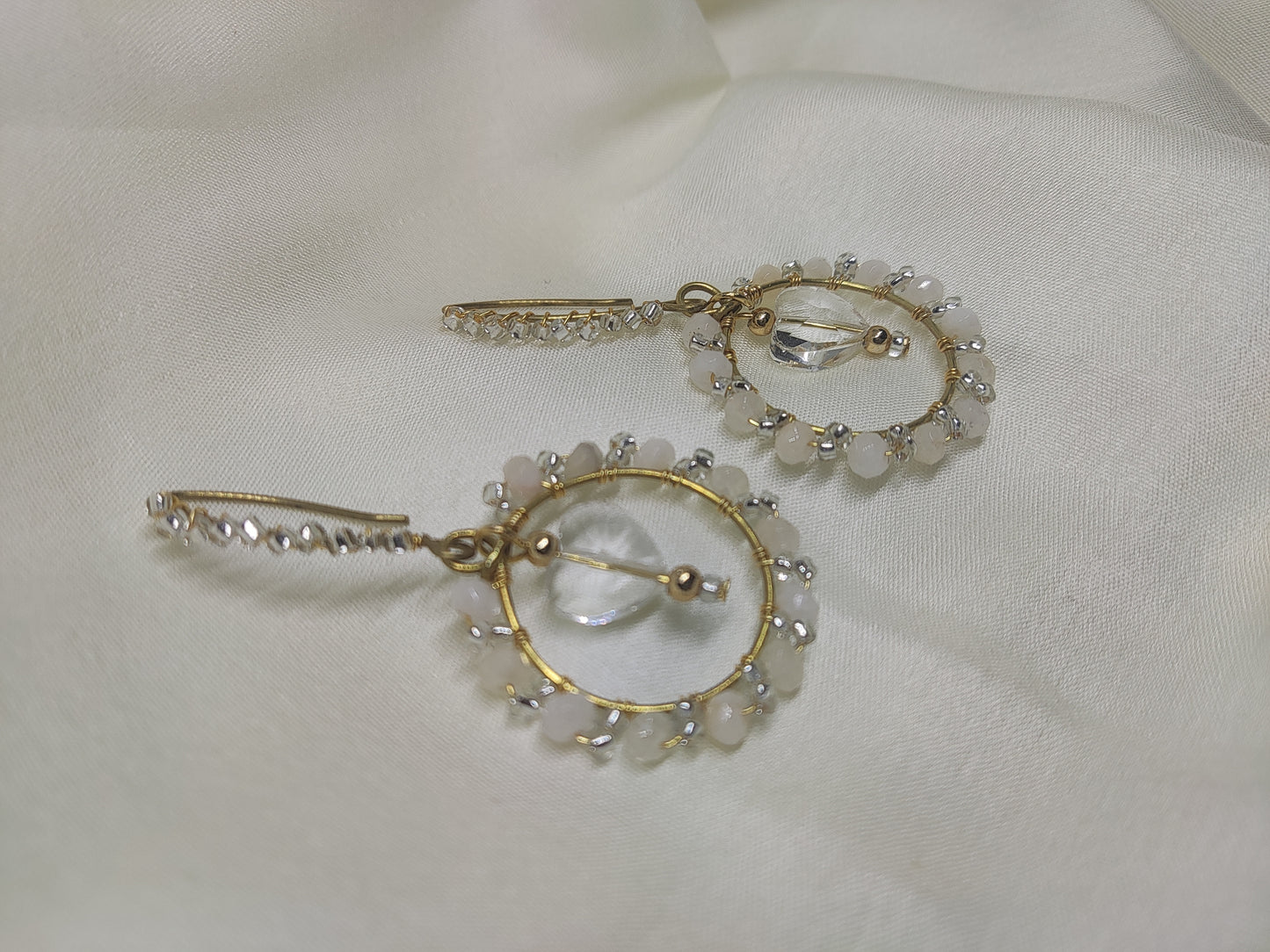 Anusangi Collections handmade green wire wrap earrings with delicate white beads on gold hoops