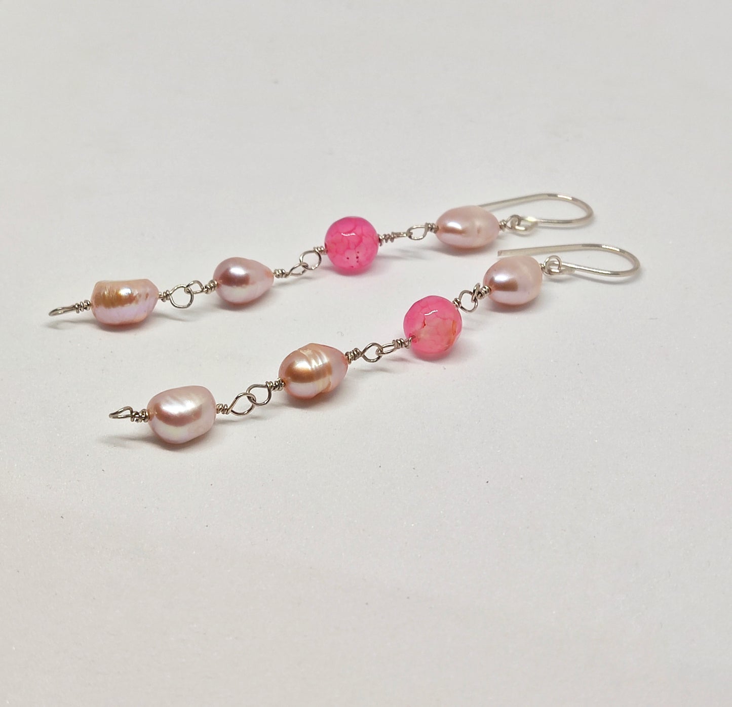 Handmade sterling silver earrings with pink beads and pearls by Anusangi Collections