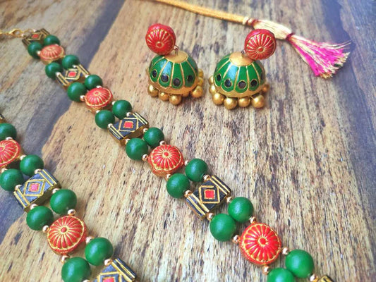 Handmade Sudarshan Chakra Terracotta jewelry set with green and red beads and traditional design from Anusangi Collections