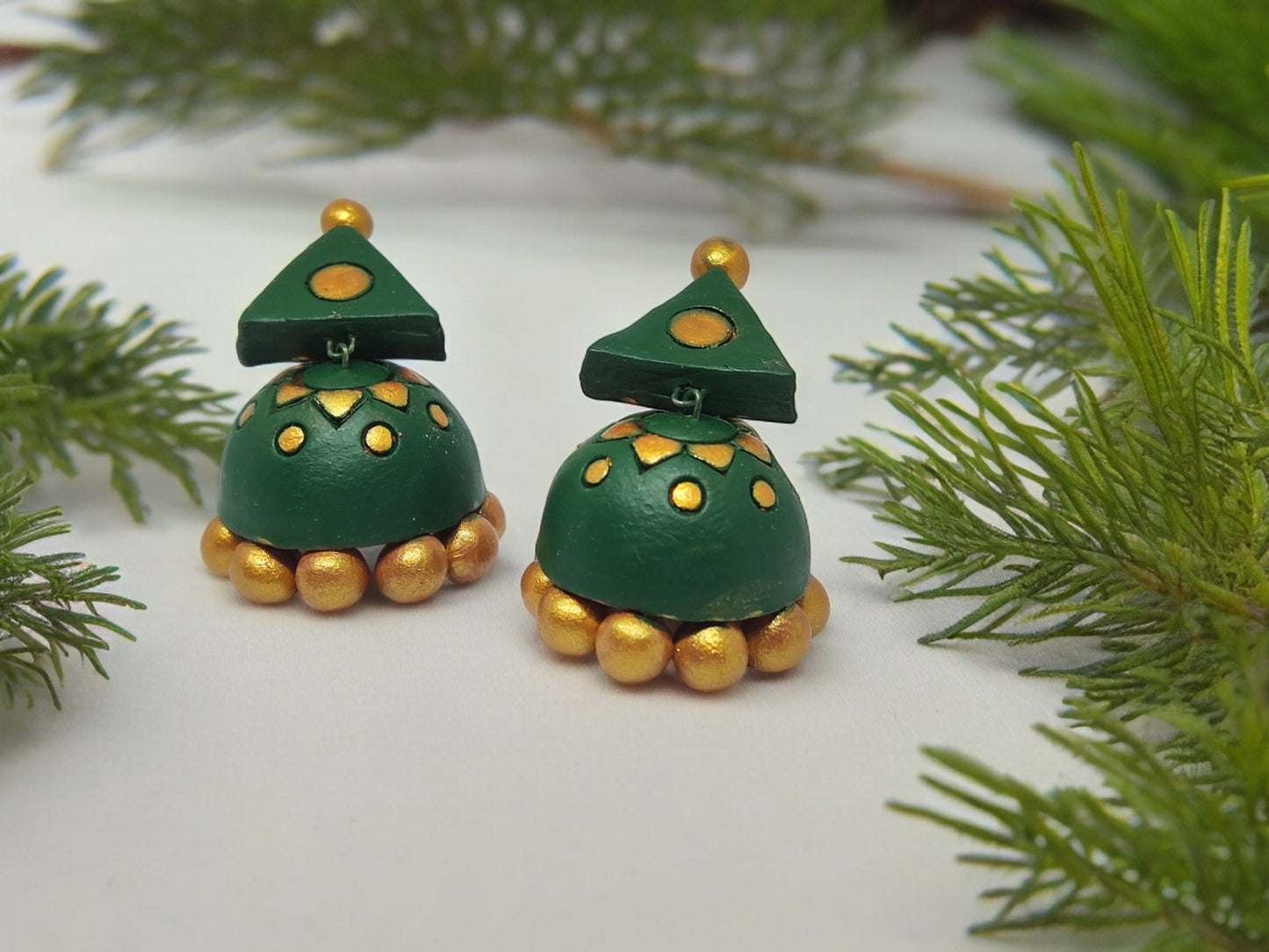 Green and gold terracotta earrings from Anusangi Collections showcasing handmade terracotta jewelry craftsmanship