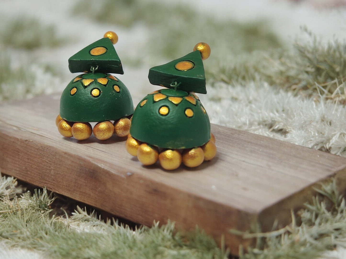 Green terracotta earrings with gold accents from Anusangi Collections featuring handmade terracotta jewelry