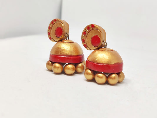 Anusangi Collections terracotta jhumka earrings in gold and red with bead details