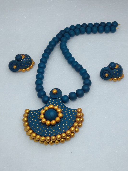 Handmade terracotta necklace and earrings set in blue and gold from Anusangi Collections
