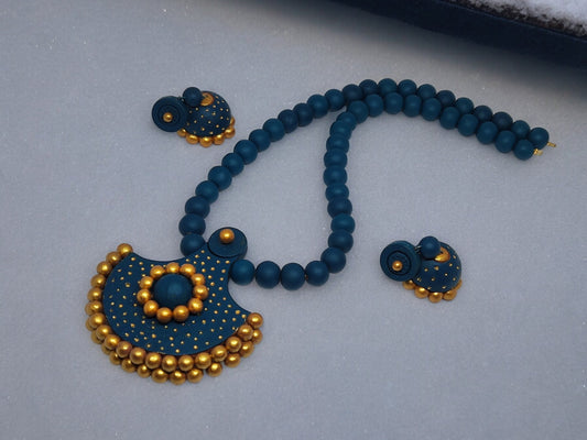 Handmade terracotta necklace and earrings set in blue and gold by Anusangi Collections