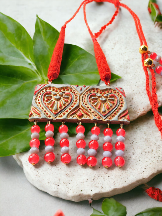 Heart motif terracotta jewelry set necklace with red and white beads by Anusangi Collections