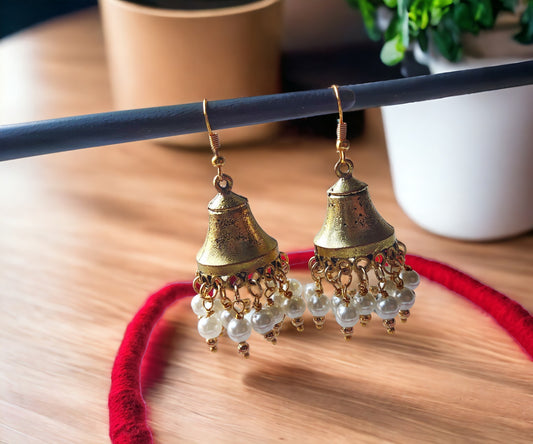 Heart motifs brass jewelry set featuring antique brass jhumka earrings with pearl bead accents