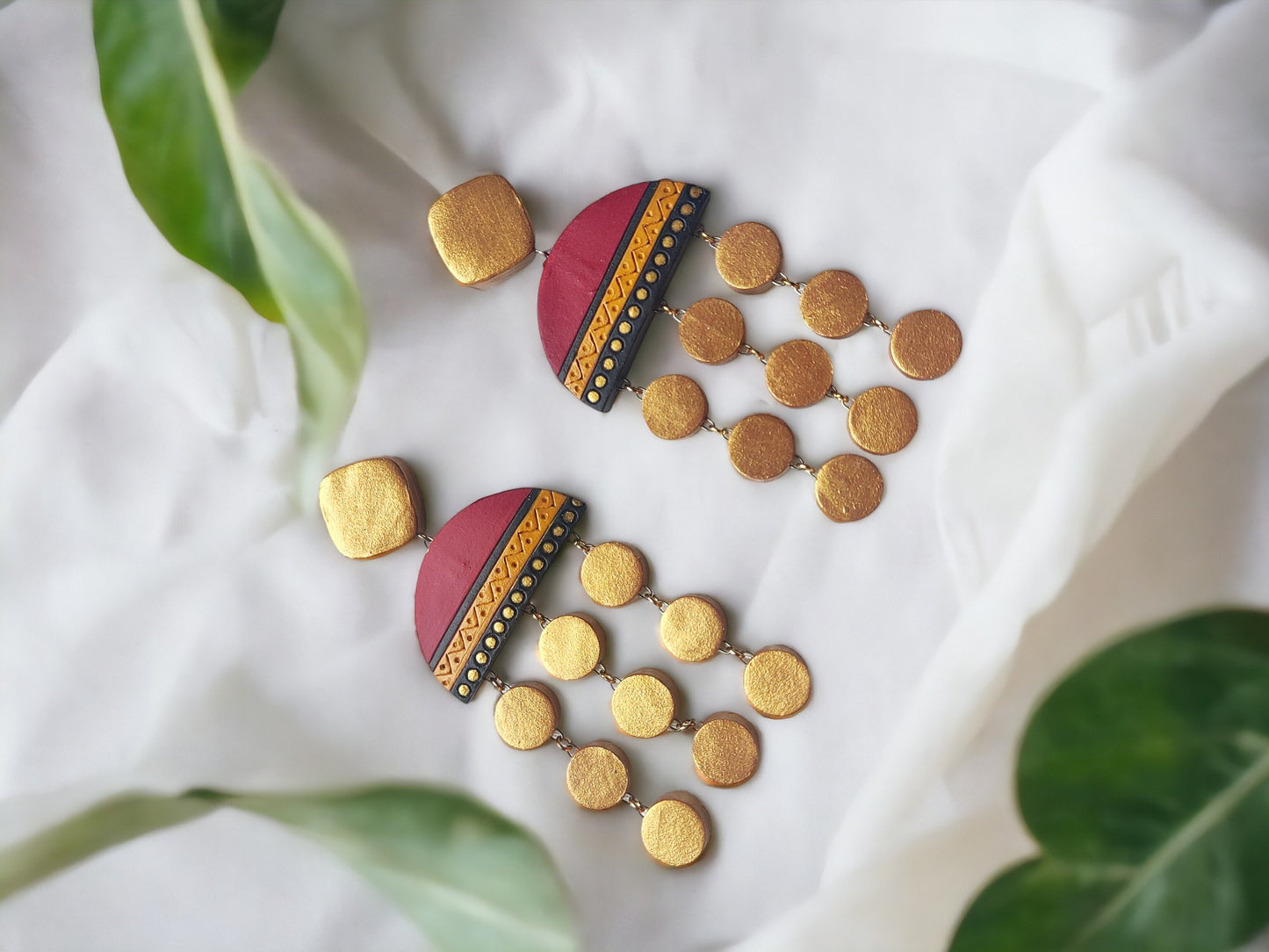 Anusangi Collections Ishani long earrings terracotta handcrafted with red and gold circular design