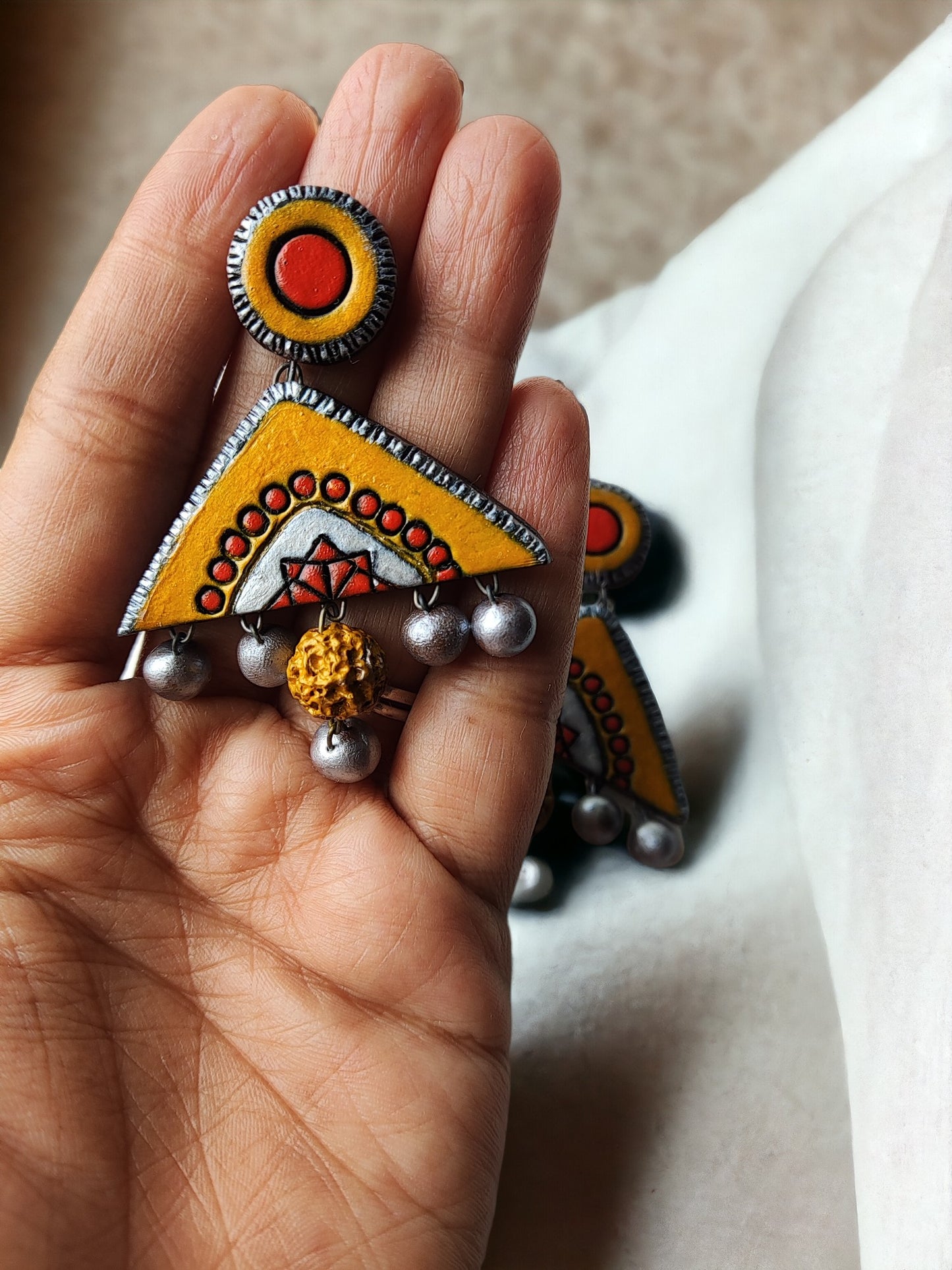 Kasturi terracotta jewelry yellow and orange terracotta earring with silver bead accents by Anusangi Collections